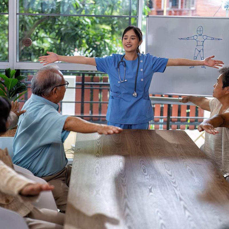 At home care service nurse caregiver take the lead to elderly person exercise in every morning